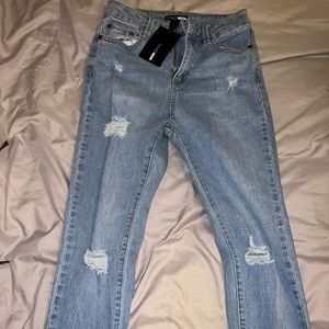 Light blue ripped jeans